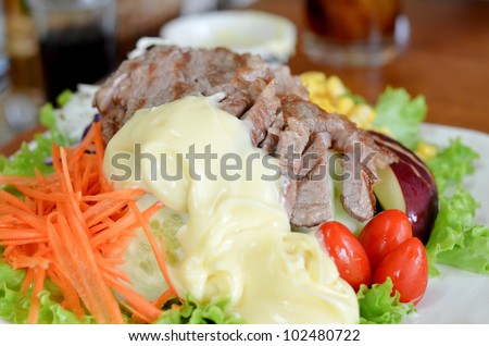 mixed fruit and vegetable ,  salad with roasted beef and cream sauce