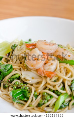 Spaghetti with spicy prawn on white dish