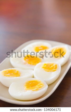 slice of boiled eggs on pink dish