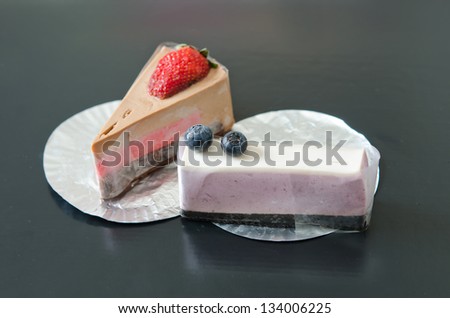 blueberries cheesecake and strawberry cheesecake , sweet dessert