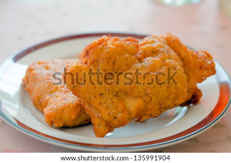 Fresh fried chicken on dish , fast food dish