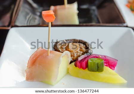 fish  and fruit sticks with  melon and mixed pickled vegetable