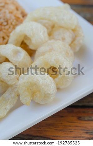 close up of crispy fried pork fat also known as chicharon