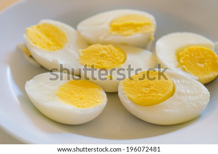 close up slice of boiled eggs on dish