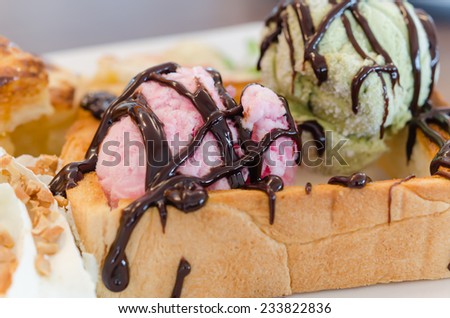 Honey toast and whipping cream with chocolate  sauce and ice cream