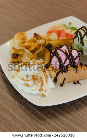 Honey toast and whipping cream with chocolate  sauce and ice cream