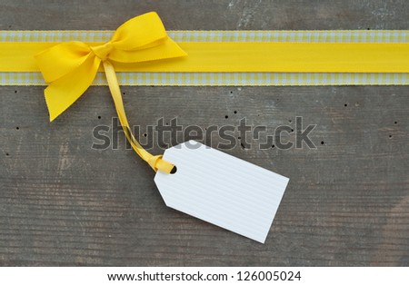 yellow loop and label on wooden ground/yellow/label