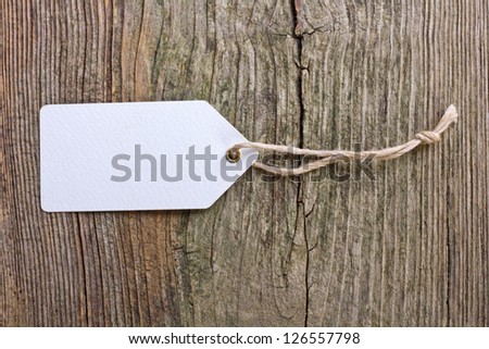 White label on wooden ground/label/white