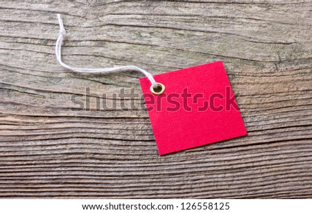red label on wooden ground/label/red