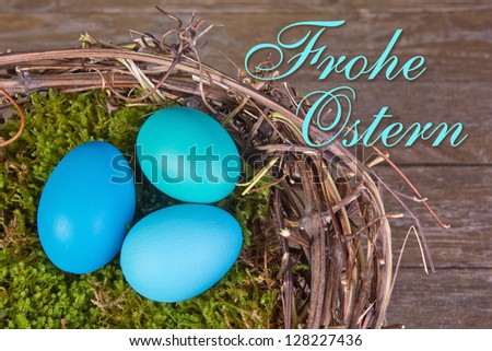 Easter card with painted blue easter eggs in a nest/easter/nest