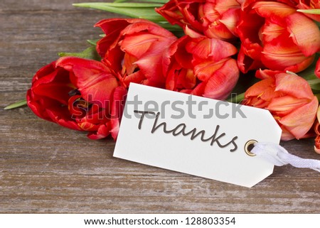 red tulips and label with lettering thanks/thanks/tulips