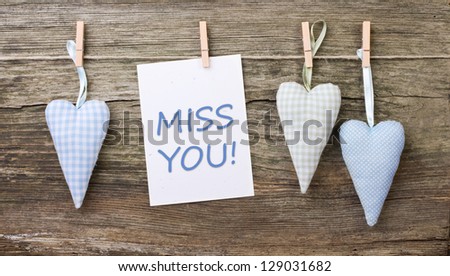 hearts, close spins and card with lettering miss you/miss you/hearts