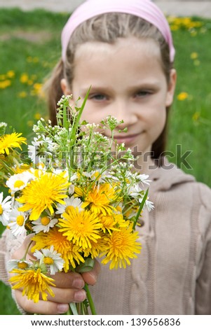 A girl with wild flowers /spring/wild flowers