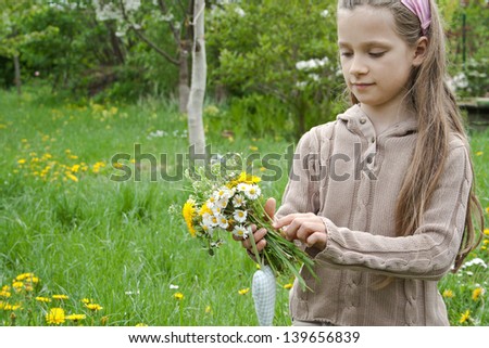 A girl with wild flowers /spring/wild flowers