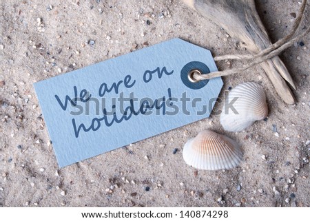 label and  sand and with lettering we are on holiday/beach/holiday