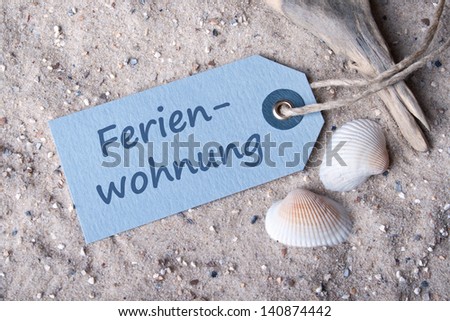 label, sand and shells  with lettering apartment/apartment/holiday