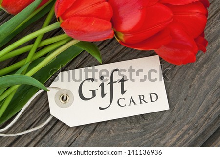 red tulips, gorse and gift card/tulips/gift card