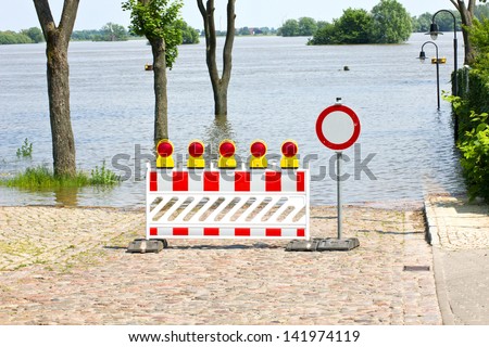 street with high water and barrier/water/flood