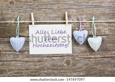 Wedding anniversary  card and hearts on wooden ground/Wedding anniversary/heart