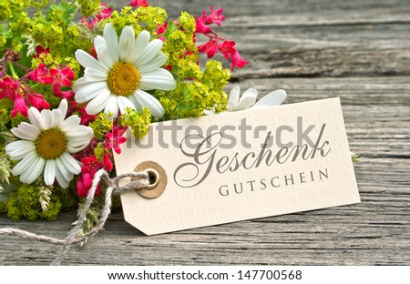 flowers and label with gift card/flowers/gift card