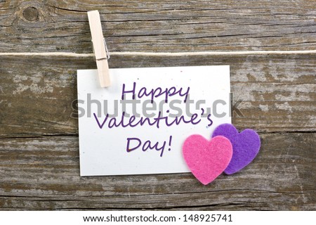 hearts and valentine`s day card with clothespins on wooden ground/ valentine`s day/hearts