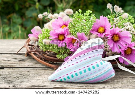 pink flowers with heart on wooden ground/heart/flowers