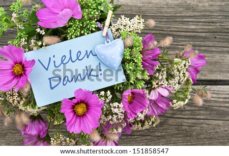 pink flowers with card with lettering thank you/thank you/flowers