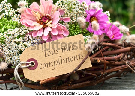 Flowers and card with lettering all the best/all the best/french