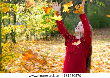 Girl with colored leaves/autumn/leaves