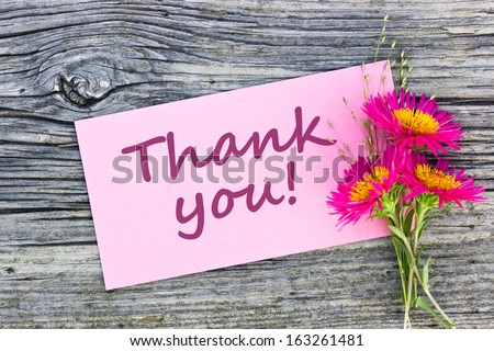 Pink flowers and pink card with lettering Thank you/Thank you/english