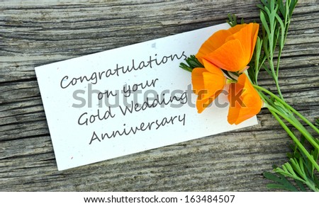 gold wedding anniversary card with red flowers/congratulation on your gold wedding anniversary/spanish