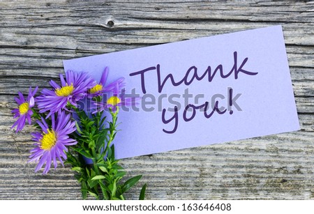 Violet flowers and card with lettering thank you/thank you/english