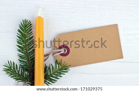 Yellow candle, fire branch and label/christmas/candle