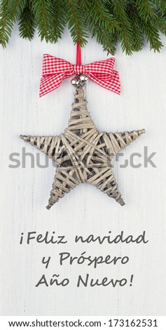 Christmas card with star/merry christmas and a happy new year/spanish