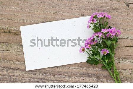 pink flowers on a wooden board with card/pink flowers/flowers