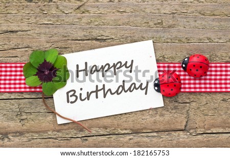 Birthday card with leafed clover and ladybugs/happy birthday/english