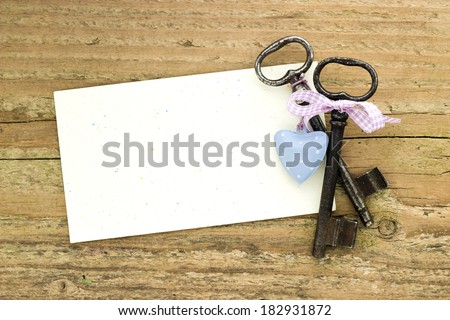 Two keys, heart and card on  board/two keys/heart