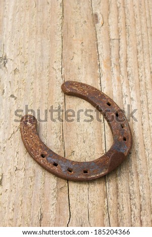 horseshoe  on wooden board/luck/horseshoe