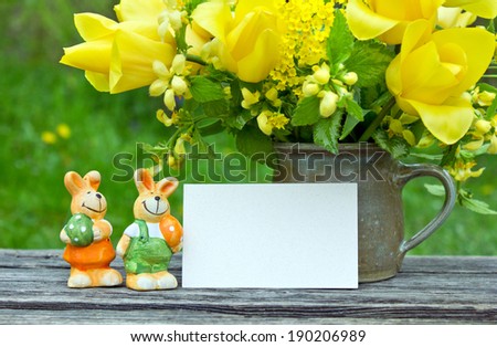 Bouquet with yellow tulips, easter bunnies and card/easter/flowers