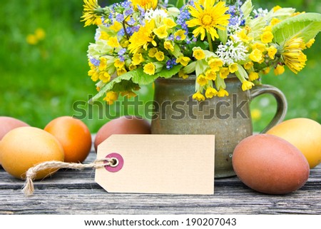 Bouquet with spring flowers easter eggs and label/easter/flowers