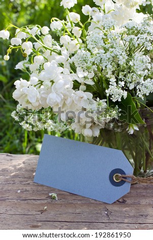 Lily of the valley, lilac, elder and label/flowers/May