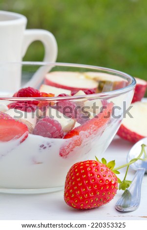 Raspberries, strawberries and apples with yogurt/fruits/food