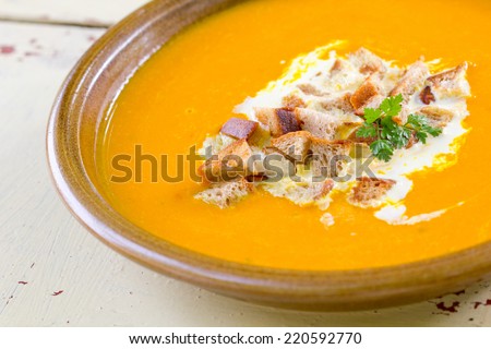 pumpkin soup with cream and bread/pumpkin soup/cooking