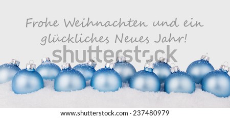 german Christmas card with blue christmas balls and text Merry Christmas and a happy New Year/Merry Christmas and a happy New Year/german
