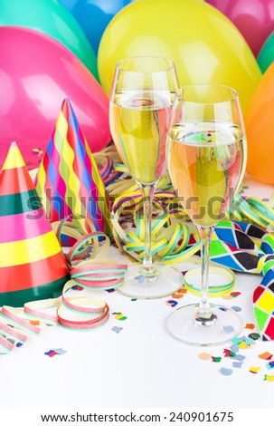 Sparkling wine, streamers, confetti and party hat/party/carnival