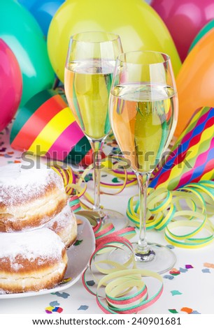 Donuts, Sparkling wine, streamers, confetti and party hat/party/carnival