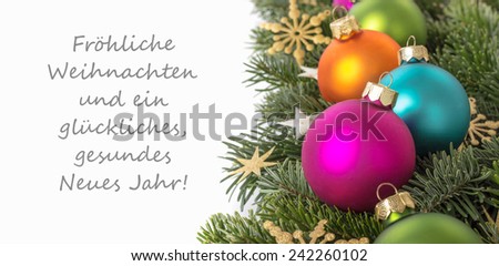 german Christmas card Christmas baubles, fir branches, golden stars and text Merry Christmas and a happy New Year/Merry Christmas and a happy New Year/german