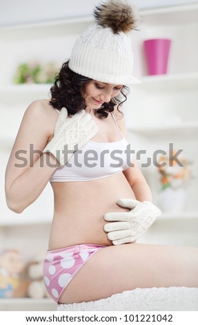 pregnant woman with winter hat and gloves