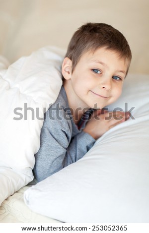 Portrait of smiling boy going to sleep