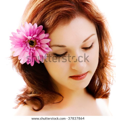 portrait of beautiful girl with flower in the hair